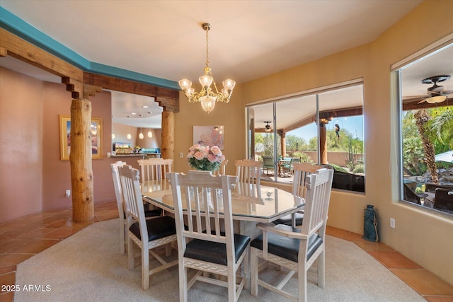 25483 N Wrangler Rd, Scottsdale, AZ 85255 - dining area featuring tile patterned flooring, plenty of natural light, and a chandelier