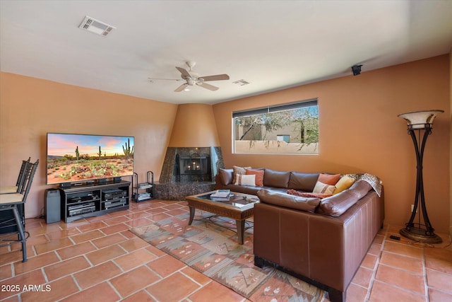 25483 N Wrangler Rd, Scottsdale, AZ 85255 - living room featuring a ceiling fan, tile patterned floors, and a premium fireplace