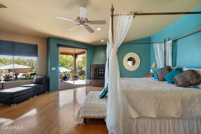 25483 N Wrangler Rd, Scottsdale, AZ 85255 - bedroom with access to outside, a premium fireplace, wood-type flooring, and recessed lighting