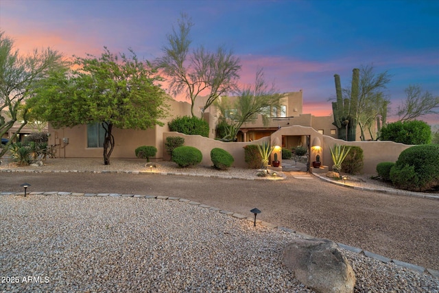 25483 N Wrangler Rd, Scottsdale, AZ 85255 - adobe home featuring fence and stucco siding