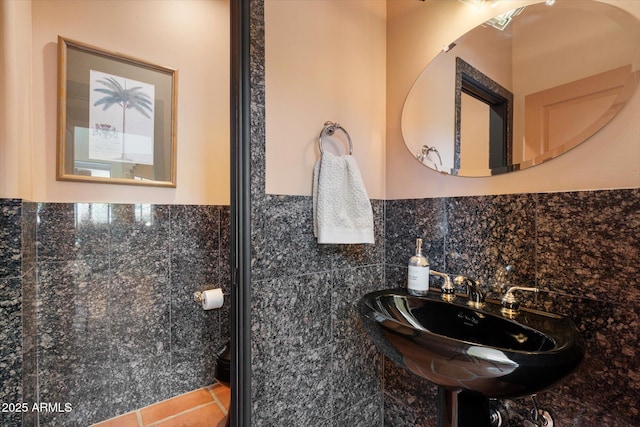25483 N Wrangler Rd, Scottsdale, AZ 85255 - bathroom with tile walls, tile patterned flooring, toilet, wainscoting, and a sink