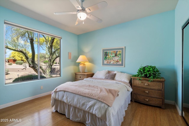 25483 N Wrangler Rd, Scottsdale, AZ 85255 - bedroom with baseboards, wood finished floors, and ceiling fan