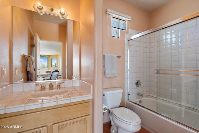 25483 N Wrangler Rd, Scottsdale, AZ 85255 - full bathroom featuring combined bath / shower with glass door, toilet, and vanity