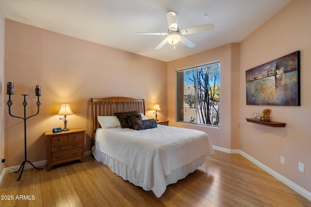 25483 N Wrangler Rd, Scottsdale, AZ 85255 - bedroom with baseboards, light wood finished floors, and ceiling fan
