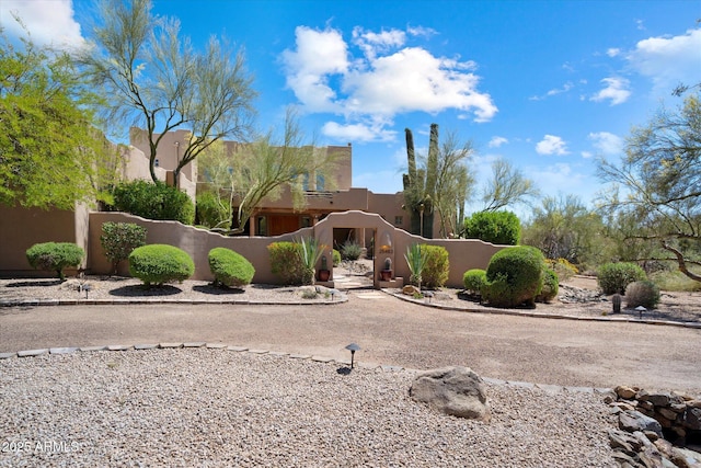 25483 N Wrangler Rd, Scottsdale, AZ 85255 - view of front facade with a fenced front yard and stucco siding