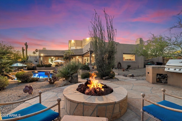 25483 N Wrangler Rd, Scottsdale, AZ 85255 - view of patio / terrace with an outdoor fire pit and area for grilling