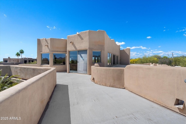 25483 N Wrangler Rd, Scottsdale, AZ 85255 - view of front of property with stucco siding and a patio area