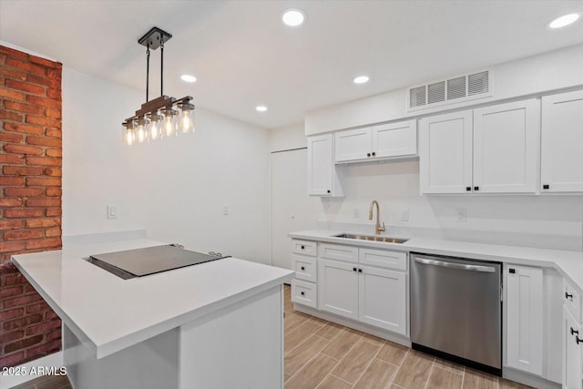 kitchen with sink, decorative light fixtures, black electric cooktop, dishwasher, and white cabinets