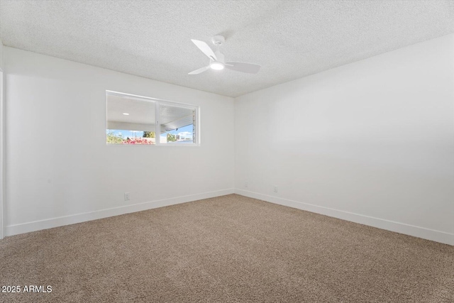 carpeted empty room featuring ceiling fan and a textured ceiling