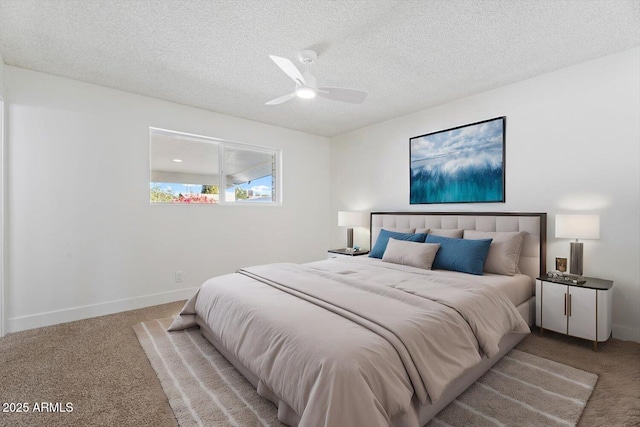 carpeted bedroom with a textured ceiling and ceiling fan