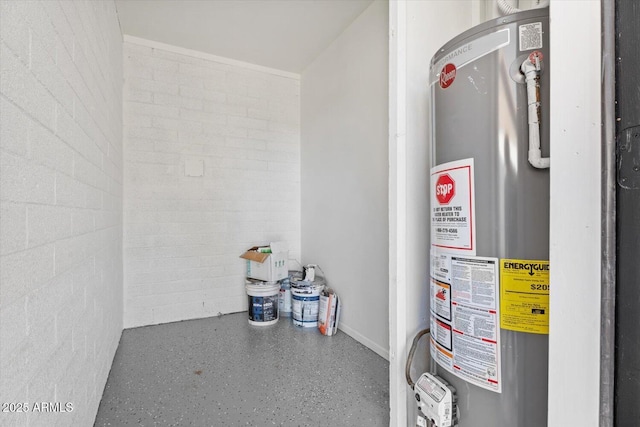 utility room featuring water heater