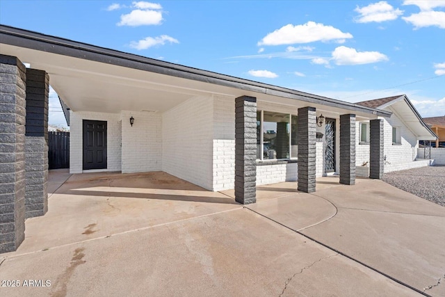 entrance to property with a carport