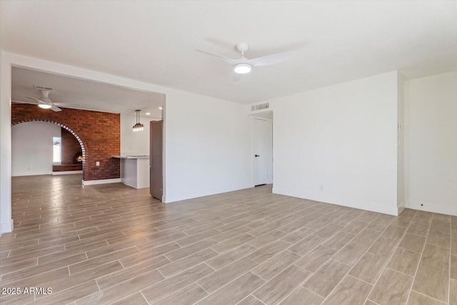 unfurnished room featuring ceiling fan and light hardwood / wood-style floors