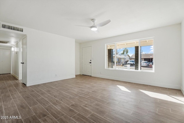 unfurnished living room with wood-type flooring and ceiling fan