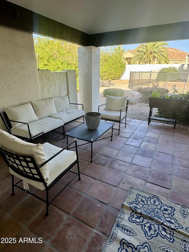 view of patio / terrace featuring fence and an outdoor hangout area