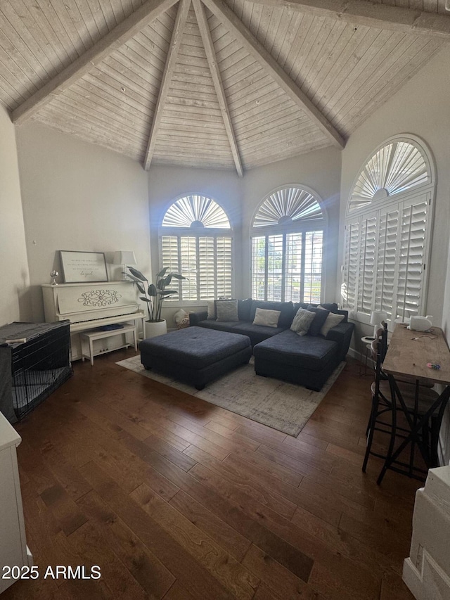 living area featuring hardwood / wood-style floors, high vaulted ceiling, beamed ceiling, and wooden ceiling