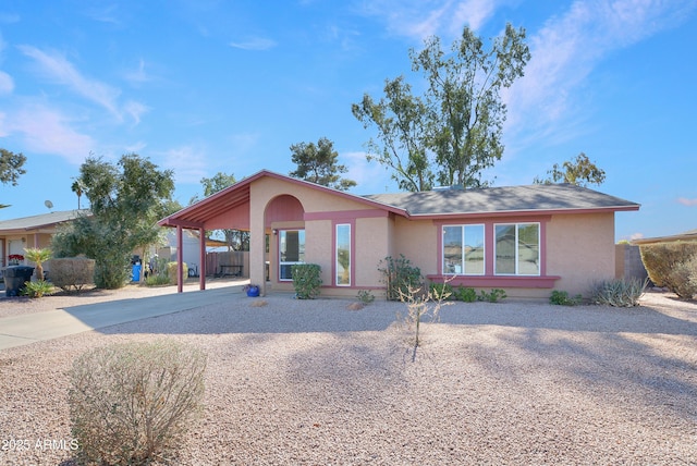 single story home featuring a carport