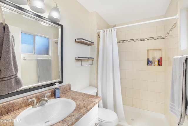 bathroom with vanity, toilet, and a shower with shower curtain