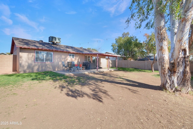 back of house featuring a patio and central AC unit