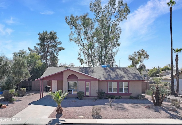 single story home featuring a carport