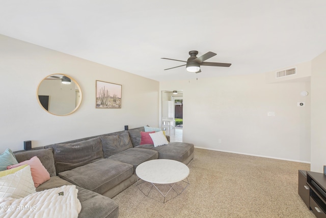 living room with ceiling fan and carpet floors