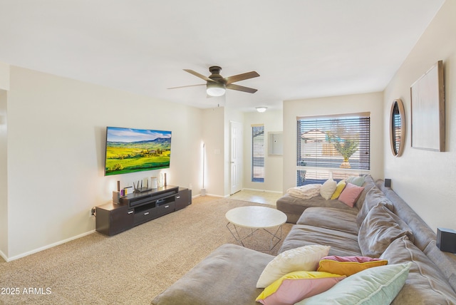 living room with light colored carpet and ceiling fan