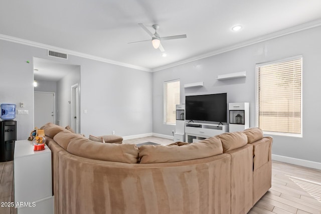 1442 W Laurel Ave, Gilbert, AZ 85233 - living room with ceiling fan, ornamental molding, baseboards, light wood-style floors, and recessed lighting