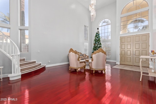 1442 W Laurel Ave, Gilbert, AZ 85233 - foyer featuring a towering ceiling, hardwood / wood-style flooring, stairs, healthy amount of natural light, and baseboards