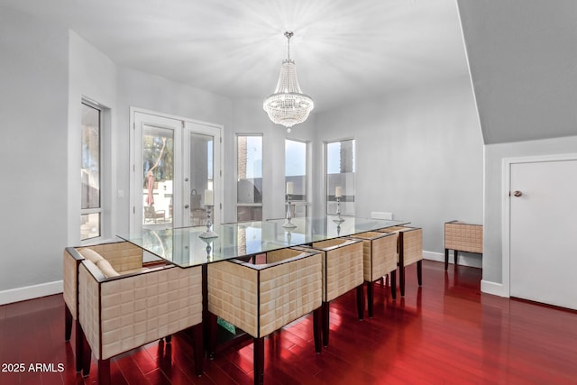 1442 W Laurel Ave, Gilbert, AZ 85233 - dining space featuring healthy amount of natural light, baseboards, a chandelier, and wood finished floors