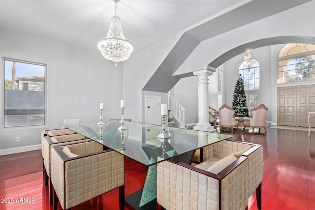1442 W Laurel Ave, Gilbert, AZ 85233 - dining room with stairs, wood-type flooring, arched walkways, and ornate columns