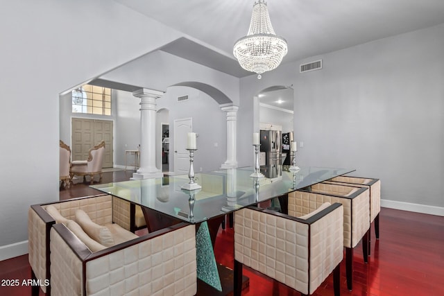 1442 W Laurel Ave, Gilbert, AZ 85233 - dining area featuring arched walkways, wood finished floors, baseboards, and a chandelier