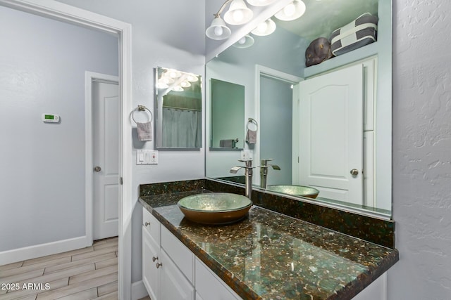 1442 W Laurel Ave, Gilbert, AZ 85233 - full bath featuring wood finished floors, vanity, and baseboards