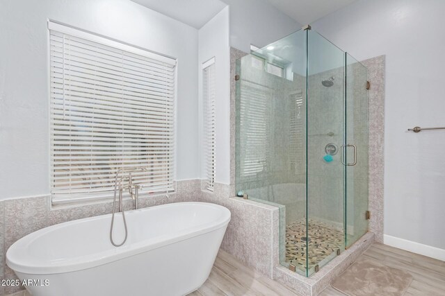 1442 W Laurel Ave, Gilbert, AZ 85233 - full bath featuring a freestanding tub, a shower stall, and wood finished floors