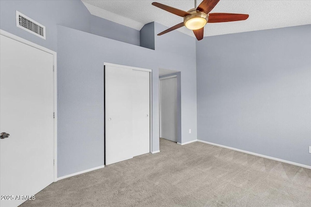 2954 N Oregon St Unit 6, Chandler, AZ 85225 - unfurnished bedroom with carpet floors, vaulted ceiling, a ceiling fan, and a textured ceiling