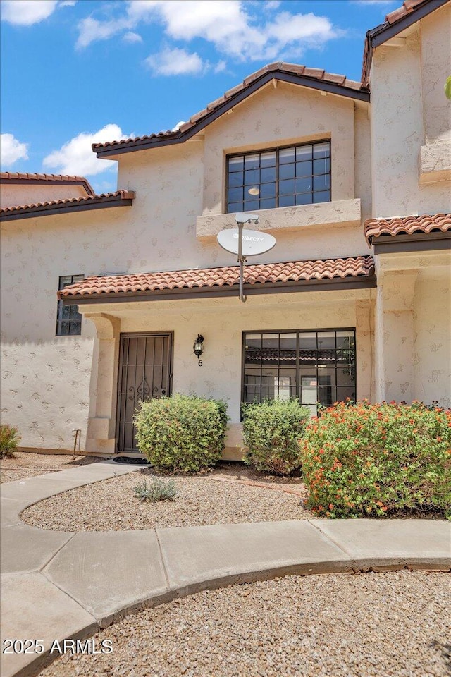 2954 N Oregon St Unit 6, Chandler, AZ 85225 - view of front of house with a tiled roof and stucco siding