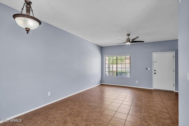 2954 N Oregon St Unit 6, Chandler, AZ 85225 - tiled empty room with a ceiling fan and a textured ceiling