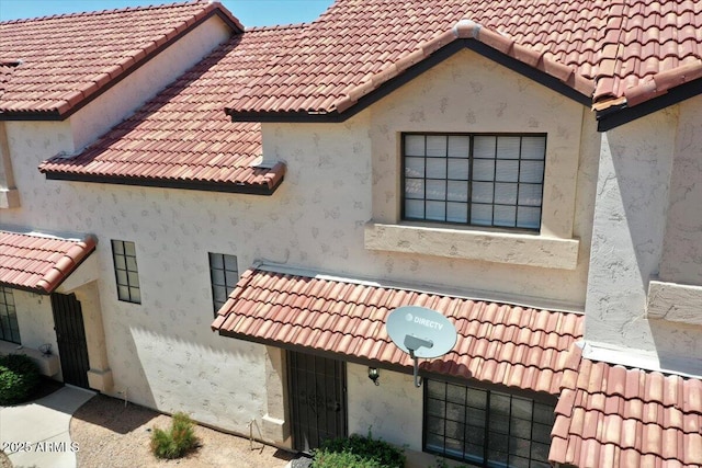 2954 N Oregon St Unit 6, Chandler, AZ 85225 - view of side of property with a tile roof and stucco siding