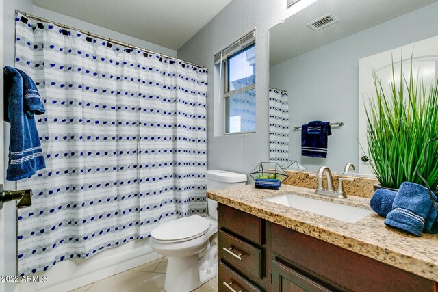 kitchen featuring light stone countertops, light tile patterned flooring, and tasteful backsplash