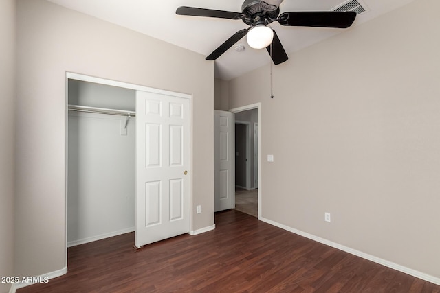 unfurnished bedroom with ceiling fan, wood finished floors, visible vents, baseboards, and a closet