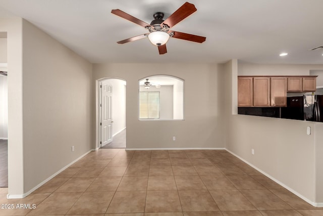 empty room with a ceiling fan, recessed lighting, baseboards, and light tile patterned floors