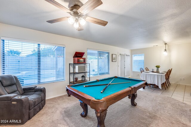 rec room featuring ceiling fan, a healthy amount of sunlight, pool table, and a textured ceiling