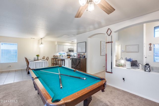 recreation room with pool table, plenty of natural light, and light colored carpet