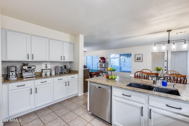 kitchen with dishwasher, white cabinetry, hanging light fixtures, and light stone countertops