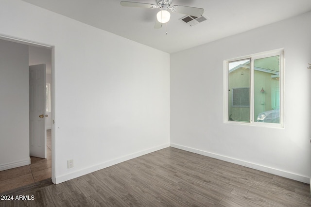 unfurnished room featuring ceiling fan and wood-type flooring