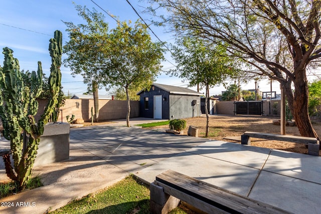 view of front facade with an outdoor structure and a patio area