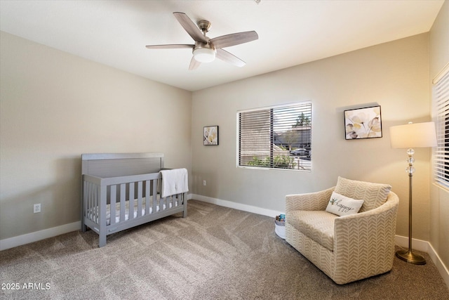 carpeted bedroom featuring a ceiling fan and baseboards