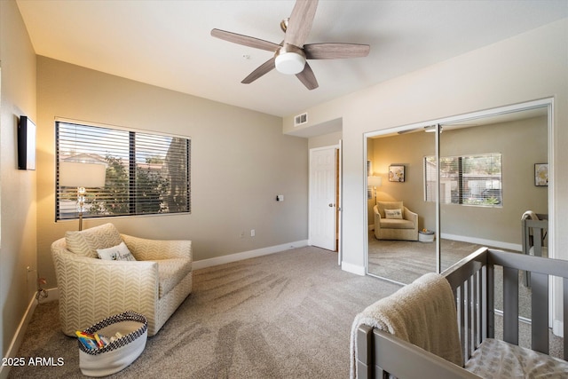 bedroom featuring visible vents, baseboards, ceiling fan, carpet, and a closet