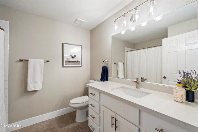 bathroom featuring visible vents, toilet, vanity, tile patterned flooring, and baseboards