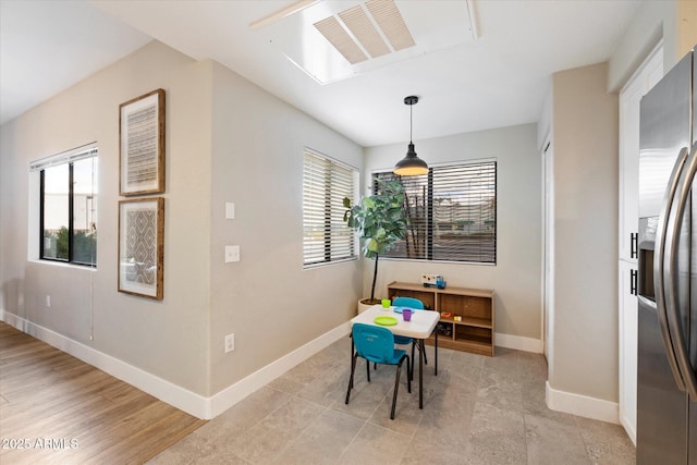 dining room featuring baseboards