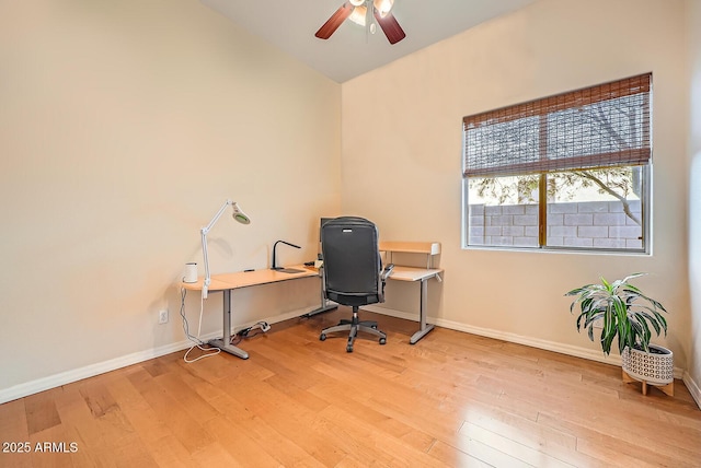 office with light wood-type flooring, baseboards, and ceiling fan